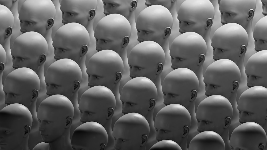 Numerous identical heads arranged in a grid.